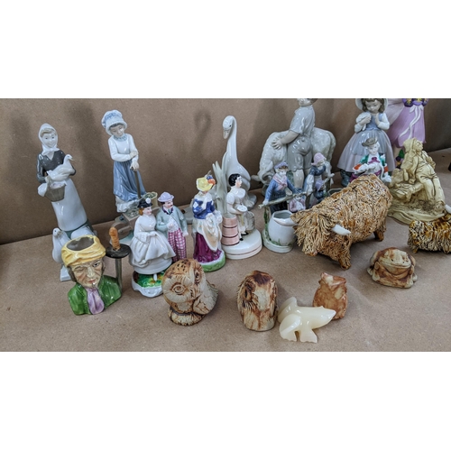 28 - A mixed lot of models and figurines to include two CWS Scottish studio pottery models of Highland Co... 