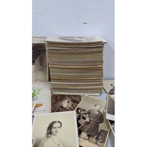 42 - A collection of Victorian carte de visite housed in a red lacquered box 
Location:A1M