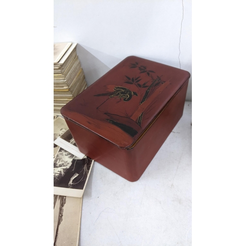 42 - A collection of Victorian carte de visite housed in a red lacquered box 
Location:A1M