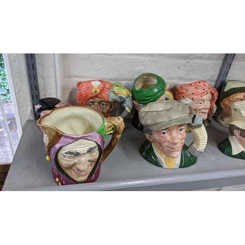 6 - A collection of mainly Royal Doulton character jugs to include The Busker, The Elephant trainer and ... 