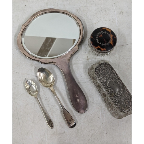 339 - Silver to include a tortoiseshell mirror pin pot, two teaspoons and a silver lidded dressing table j... 