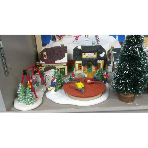 356 - A large quantity of Lemax Christmas Village buildings models and accessories, mostly boxed
Location:... 