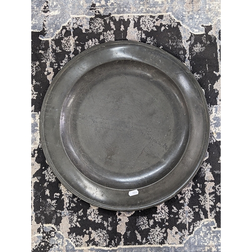 58 - A Georgian pewter charger, 47cm, inscribed to reverse with a Tudor rose and marked London
Location:F... 