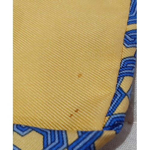 138 - Hermes-A yellow and blue silk tie with geometric pattern and branded iconic orange branded box toget... 