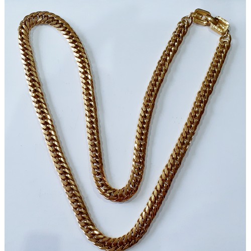 143 - Givenchy-A late 20th Century heavy gold tone chain necklace, 78cm long, with designer's name to the ... 