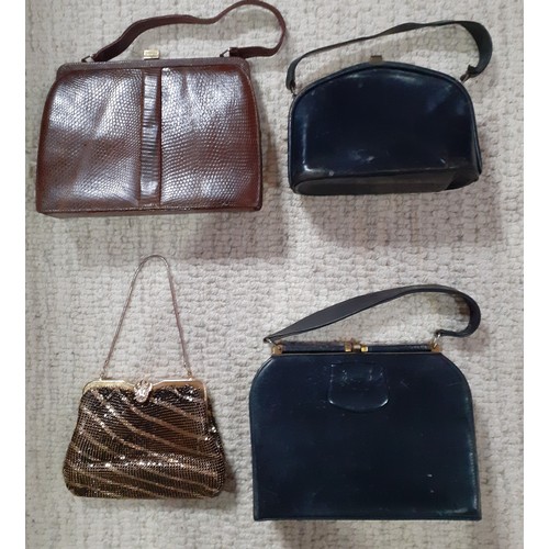 148 - A group of mid 20th Century handbags to include a Mappin & Webb brown lizard handbag and a gold tone... 