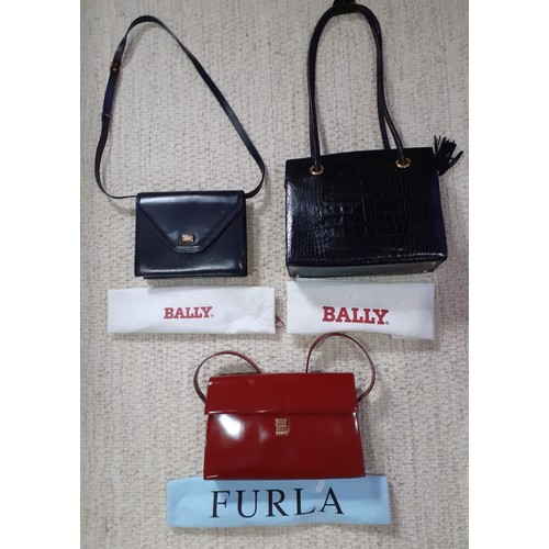 151 - Bally and Furla- Three ladies shoulder bags with branded dust-bags to include a Bally black leather ... 