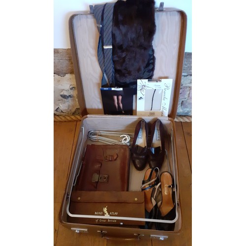 152 - A mid 20th Century brown weekend suitcase and contents to include a leather music satchel, 2 pairs o... 