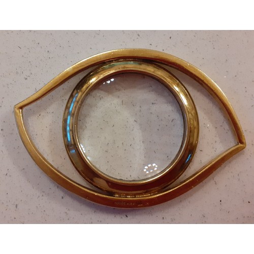 155 - Hermes- A 1980's gilt metal magnifying glass fashioned as an eye with convex lens, stamped Hermes, P... 