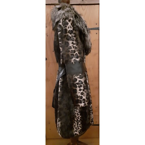 160 - Marccain- An animal print ladies coat having a wolf fur collar and zig-zag black leather waistband a... 