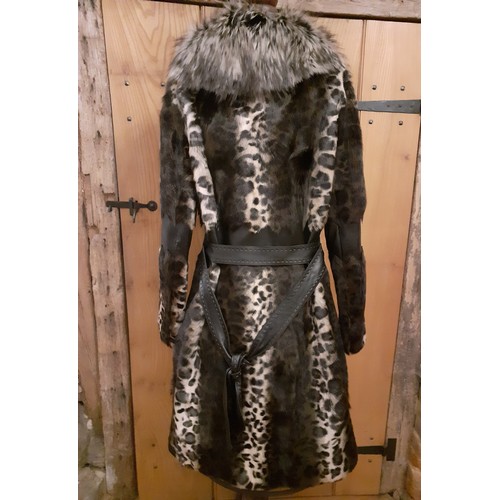 160 - Marccain- An animal print ladies coat having a wolf fur collar and zig-zag black leather waistband a... 