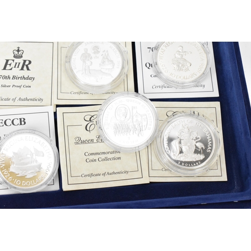 74 - A collection of 22 Elizabeth II silver proof coins, to include 70th Birthday examples, 1997 Chinese ... 