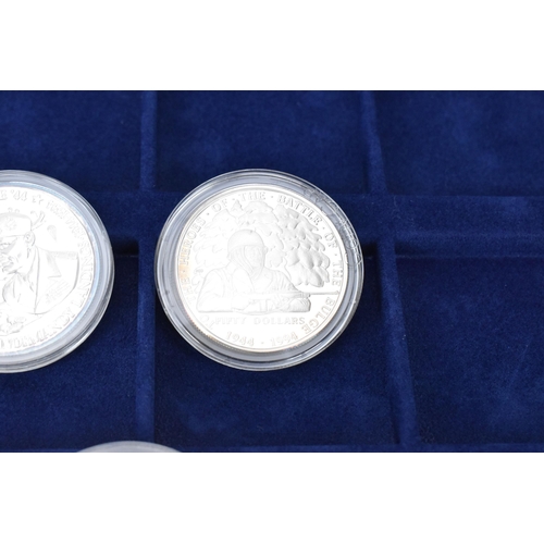 75 - Westminster Collection - ' The World at War' three silver proof coins to include the Marshall island... 