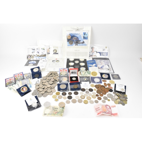 85 - A mixed lot of British and world coins to include a 24ct gold 1/25 oz 1997 golden wedding £5 coin, 1... 