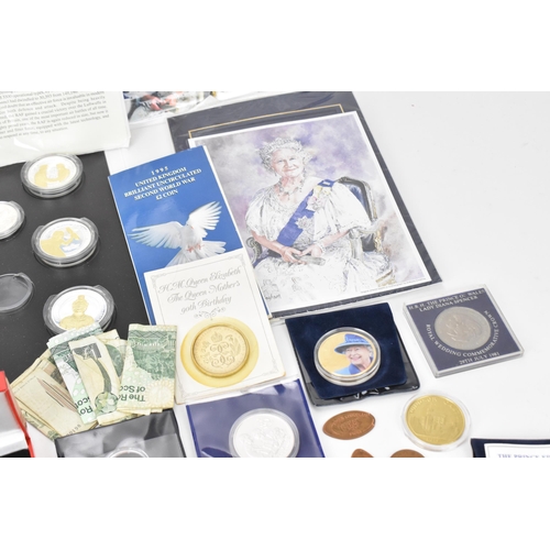 85 - A mixed lot of British and world coins to include a 24ct gold 1/25 oz 1997 golden wedding £5 coin, 1... 