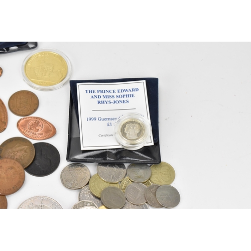 85 - A mixed lot of British and world coins to include a 24ct gold 1/25 oz 1997 golden wedding £5 coin, 1... 