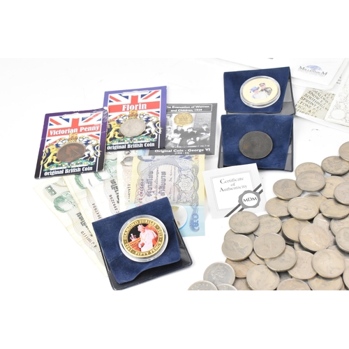 85 - A mixed lot of British and world coins to include a 24ct gold 1/25 oz 1997 golden wedding £5 coin, 1... 