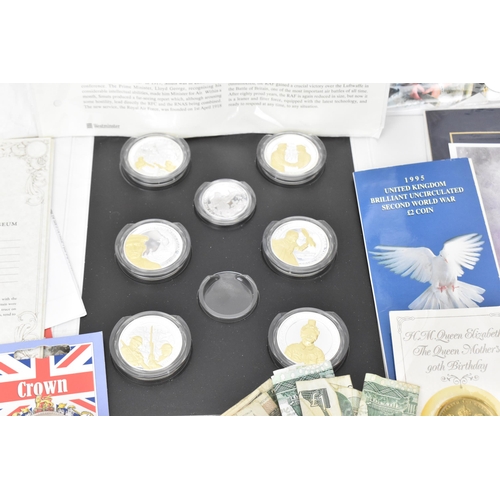 85 - A mixed lot of British and world coins to include a 24ct gold 1/25 oz 1997 golden wedding £5 coin, 1... 