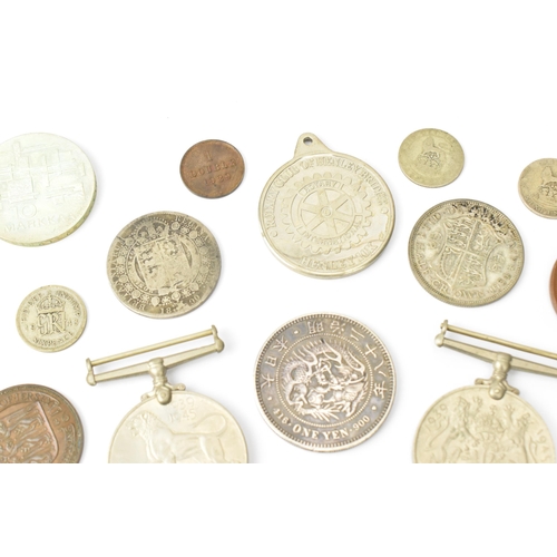 93 - A mixed collection of Victorian Silver and other coinage to include an 1882 'Morgan' Dollar, One Yen... 