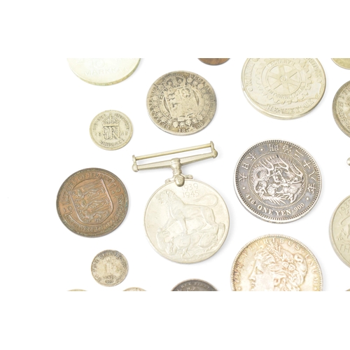 93 - A mixed collection of Victorian Silver and other coinage to include an 1882 'Morgan' Dollar, One Yen... 