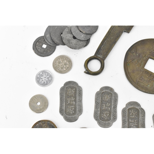 96 - A collection of Chinese and other cash coins, replica bronze knife money replica, spade money, Japan... 