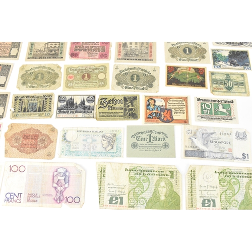 97 - A mixed collection of early 20th century and later world banknotes, to include Germany 1914, Notgeld... 