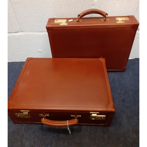 147 - Two Tanner Krolle chestnut brown leather briefcases having gold tone hardware. Location:1.2
Conditio... 