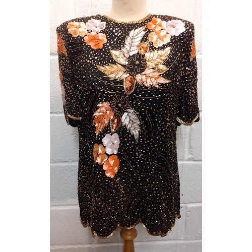 174 - Frank Usher-A 1980's bejewelled evening top with scalloped hem and sleeves, having a black ground wi... 