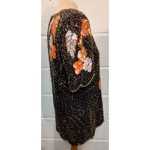 174 - Frank Usher-A 1980's bejewelled evening top with scalloped hem and sleeves, having a black ground wi... 