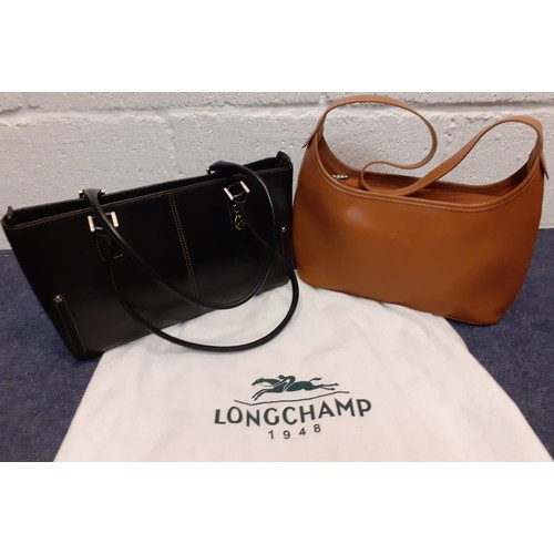 8 - Longchamp-A tan calfskin leather 'baguette' shoulder bag with fabric zipped closure, silver tone har... 