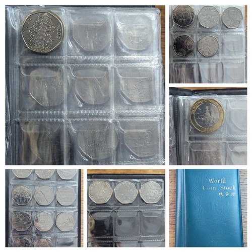 81 - An album of 20, 50p and one £2 coin to include a replica/re-strike 2009 Kew gardens 50p, London 2012... 