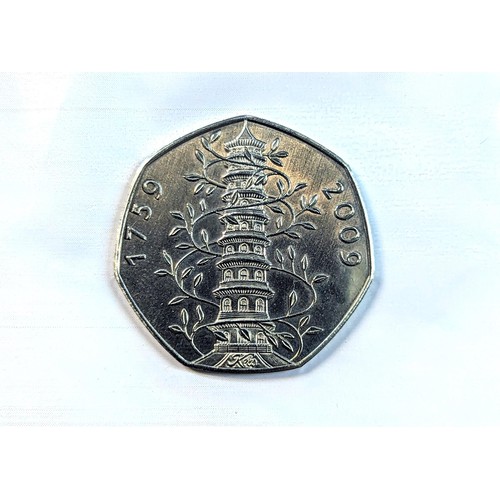 81 - An album of 20, 50p and one £2 coin to include a replica/re-strike 2009 Kew gardens 50p, London 2012... 