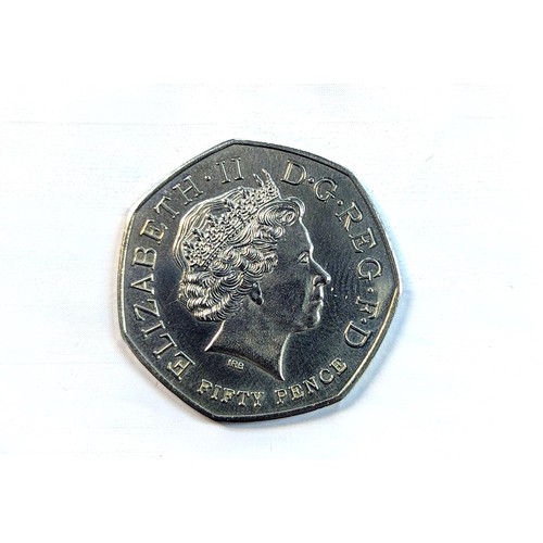 81 - An album of 20, 50p and one £2 coin to include a replica/re-strike 2009 Kew gardens 50p, London 2012... 