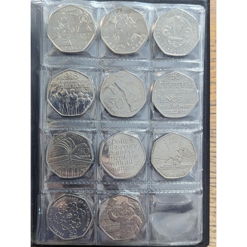 81 - An album of 20, 50p and one £2 coin to include a replica/re-strike 2009 Kew gardens 50p, London 2012... 