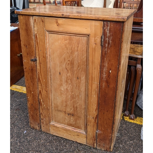 328 - A 19th century pine side cabinet having a single door and on a plinth base, 92cm h x 69.5cm w
Locati... 