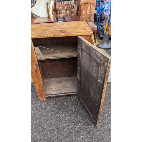 328 - A 19th century pine side cabinet having a single door and on a plinth base, 92cm h x 69.5cm w
Locati... 