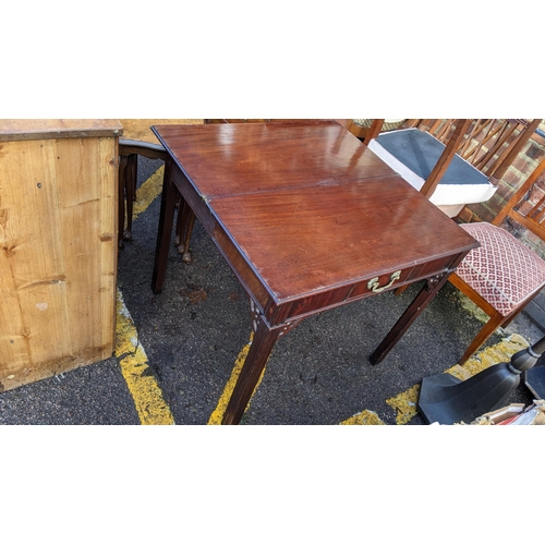 329 - A Georgian mahogany fold over tea table having a single drawer and chamfered legs, 73.5cm h x 83cm w... 