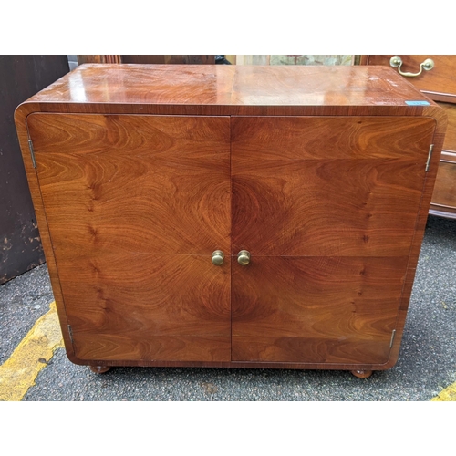 333 - An early/mid 20th century walnut veneered cocktail cabinet
Location: A1M