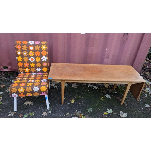 337 - A mid 20th century Nathan teak coffee table having a fall flap, 45.5cm h x 122cm w and a retro chair... 