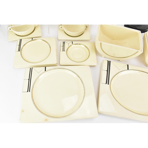 406 - An Art Deco Clarice Cliff ''Biarritz'' dinner service, comprising two platters, six dinner plates, s... 