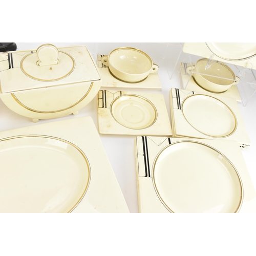 406 - An Art Deco Clarice Cliff ''Biarritz'' dinner service, comprising two platters, six dinner plates, s... 