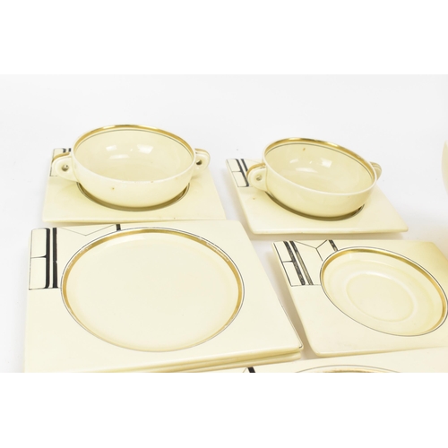 406 - An Art Deco Clarice Cliff ''Biarritz'' dinner service, comprising two platters, six dinner plates, s... 