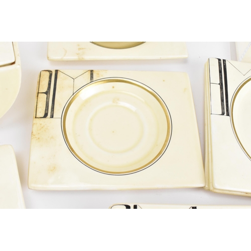 406 - An Art Deco Clarice Cliff ''Biarritz'' dinner service, comprising two platters, six dinner plates, s... 