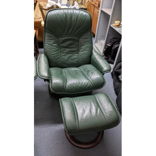 306 - A Ekornes stressless green teacher armchair with matching footstool
Location: A1M