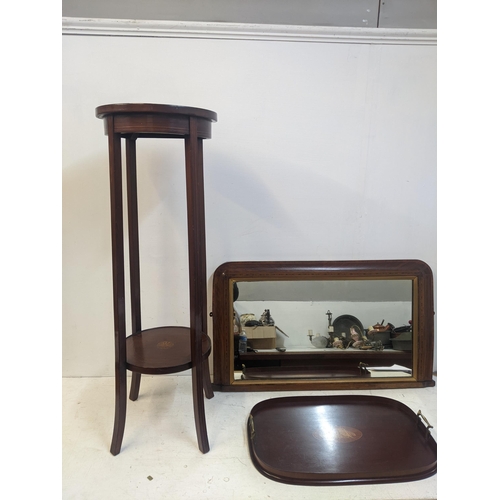 423 - Edwardian inlaid mahogany furniture to include a twin handled tray, an overmantel mirror and a plant... 