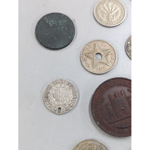 429 - A mixed group of coins of interest to include 1933 Palestine 10 mils, 1887 Victoria Jubilee Year Shi... 