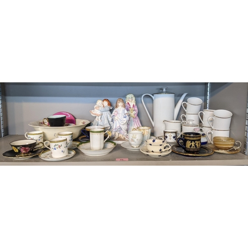 474 - Ceramics to include three Royal Worcester figures, a collection of coffee cups and saucers, a German... 