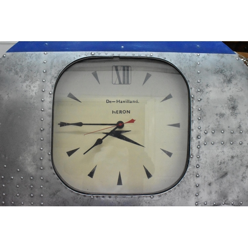 504 - A De Havilland aircraft door fashioned as a wall clock, with aluminium exterior, the window with clo... 