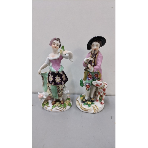 426 - A mixed lot to include two 19th century continental Chelsea style porcelain figures to include one o... 