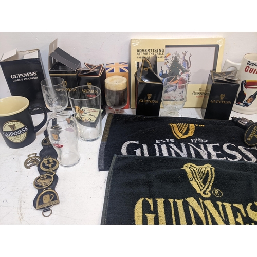 307 - Guinness related collectables to include boxed glasses, mugs, table mats, bar mats, tankards, horse ... 